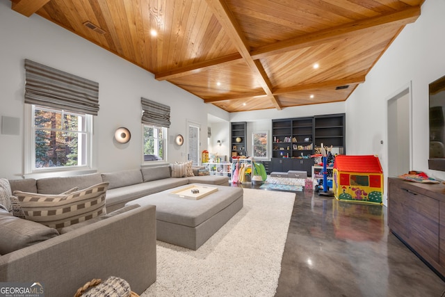 living room with concrete flooring, built in features, wooden ceiling, and beamed ceiling