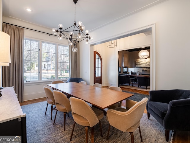 dining room featuring hardwood / wood-style floors and a notable chandelier