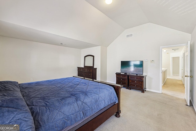 carpeted bedroom featuring lofted ceiling