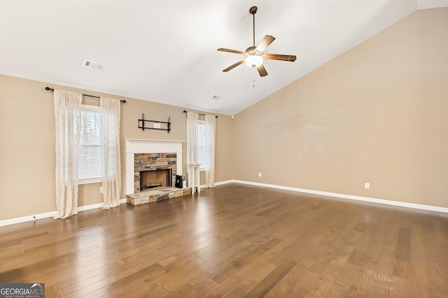 unfurnished living room featuring high vaulted ceiling, dark wood-type flooring, a fireplace, and ceiling fan