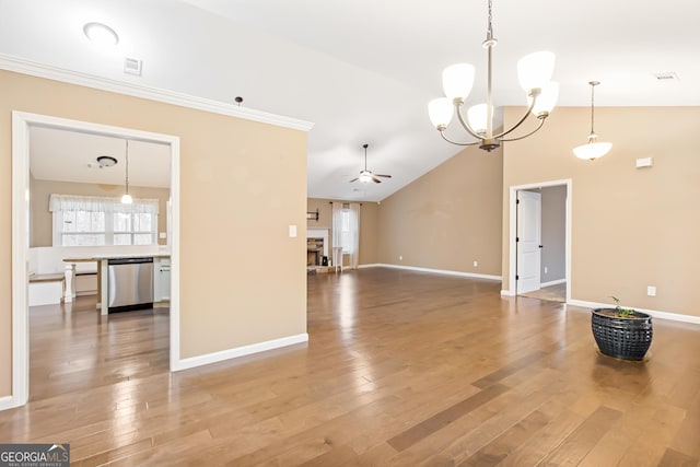 unfurnished living room featuring hardwood / wood-style flooring, ornamental molding, lofted ceiling, and ceiling fan with notable chandelier