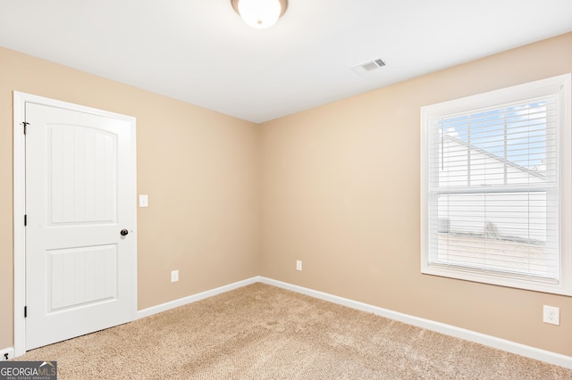 spare room featuring carpet flooring