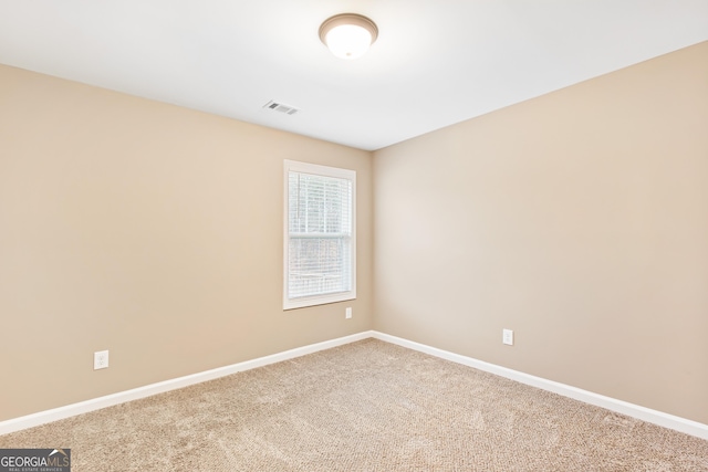 unfurnished room featuring carpet flooring