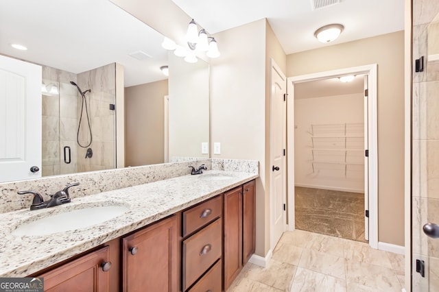 bathroom featuring vanity and a shower with door