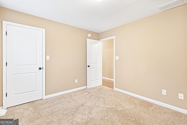 unfurnished bedroom with carpet floors