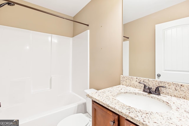 full bathroom featuring vanity, shower / bathing tub combination, and toilet