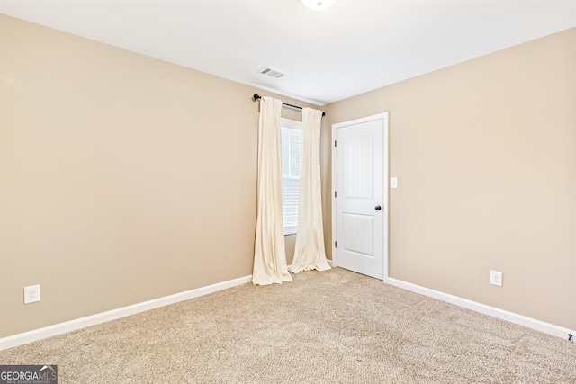 spare room featuring carpet flooring