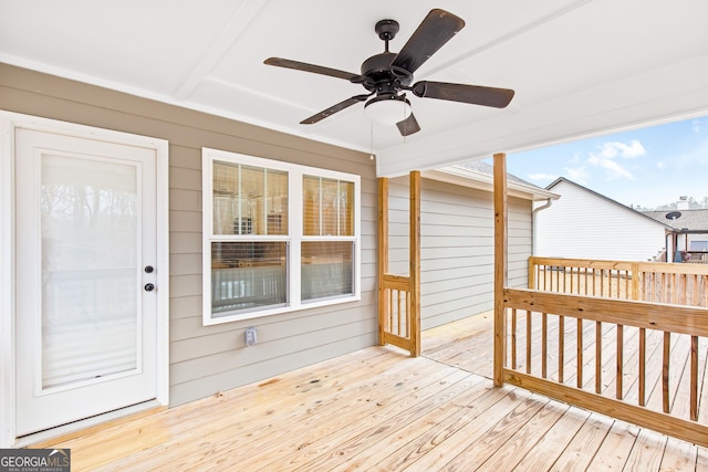 wooden terrace featuring ceiling fan