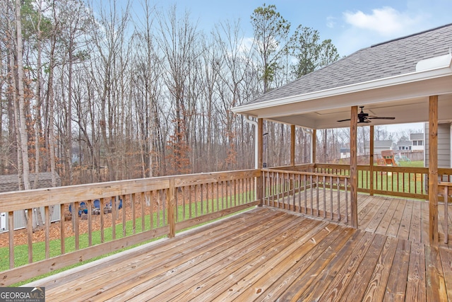 deck with a playground and ceiling fan