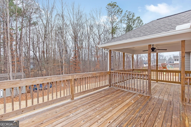 wooden deck featuring ceiling fan