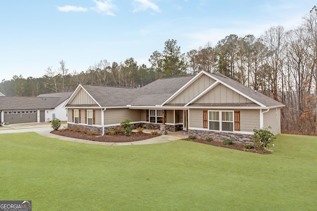 craftsman-style home with a garage and a front lawn