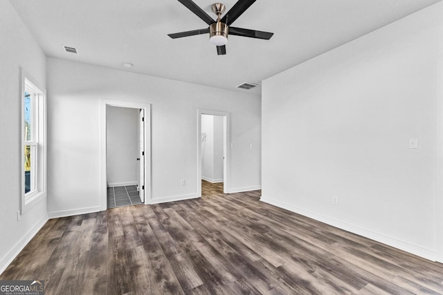 unfurnished room featuring dark hardwood / wood-style flooring and ceiling fan