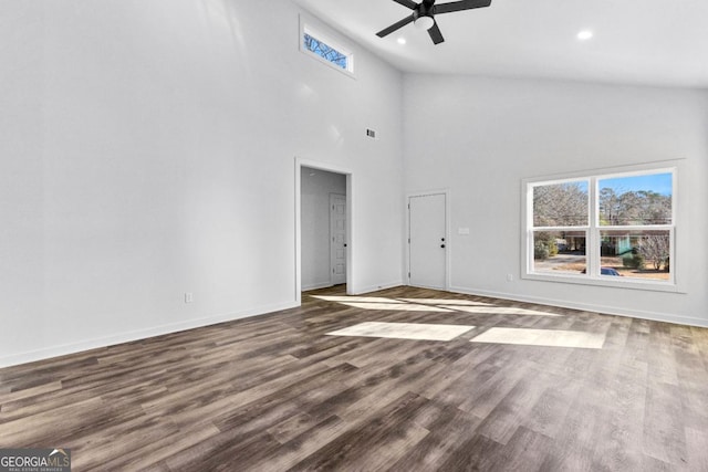 unfurnished living room with high vaulted ceiling, dark hardwood / wood-style floors, and ceiling fan