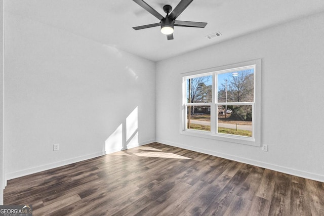 unfurnished room featuring ceiling fan and dark hardwood / wood-style flooring