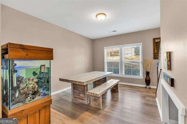 dining area featuring hardwood / wood-style flooring