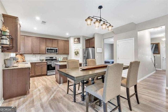 dining room featuring light hardwood / wood-style floors