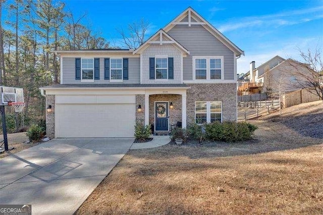 view of front of property featuring a garage and a front lawn