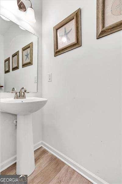 bathroom featuring sink and hardwood / wood-style floors