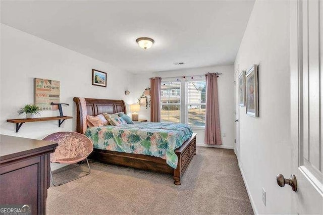 bedroom with light colored carpet