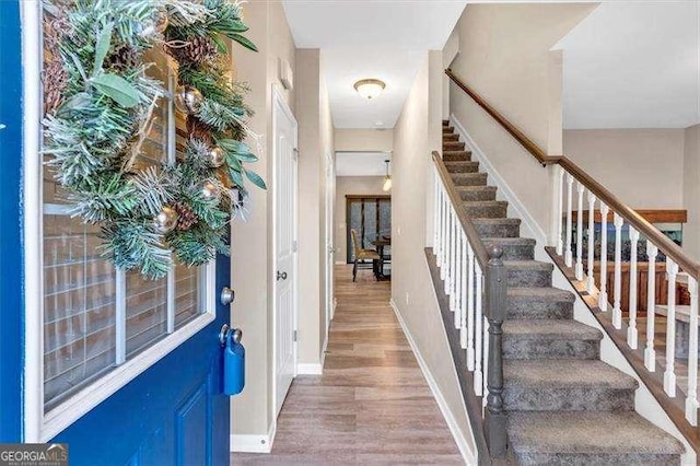 foyer entrance featuring hardwood / wood-style floors