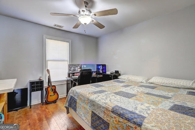 bedroom featuring ceiling fan and wood-type flooring