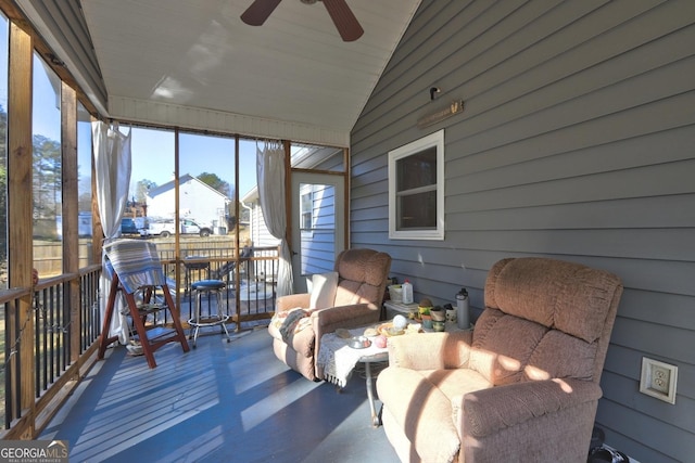 sunroom / solarium featuring vaulted ceiling and ceiling fan