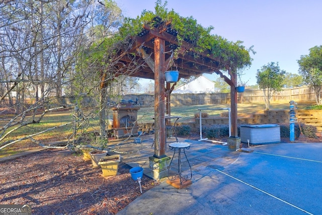 view of patio / terrace with an outdoor stone fireplace