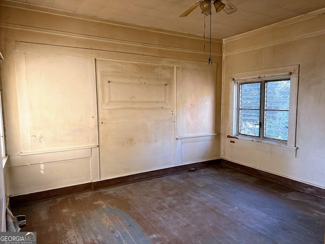 unfurnished bedroom with ceiling fan, dark hardwood / wood-style flooring, and a closet