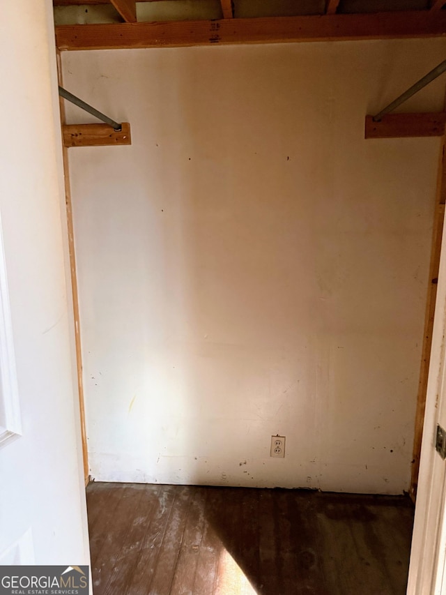 spare room with dark hardwood / wood-style flooring