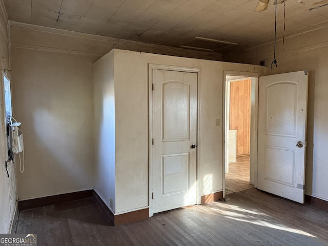 unfurnished bedroom with hardwood / wood-style floors