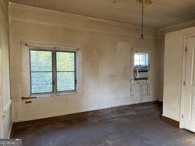 unfurnished room featuring cooling unit