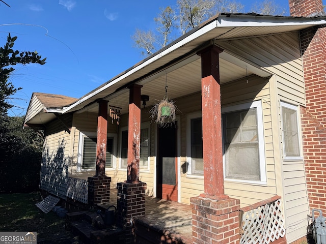 doorway to property featuring covered porch