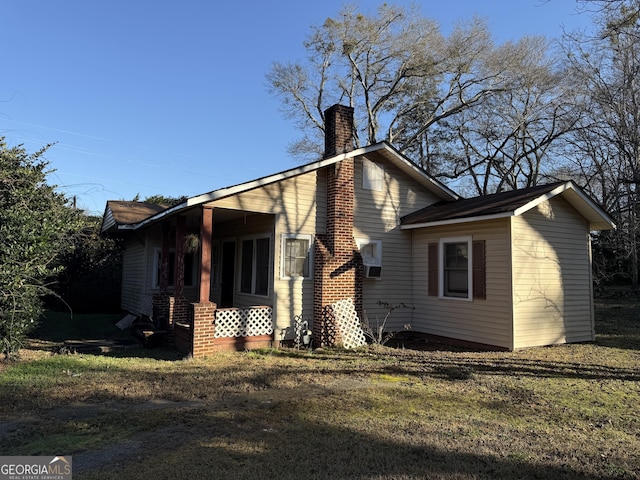 exterior space featuring a porch and a yard