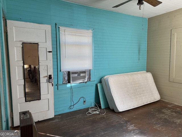 bedroom featuring cooling unit and ceiling fan