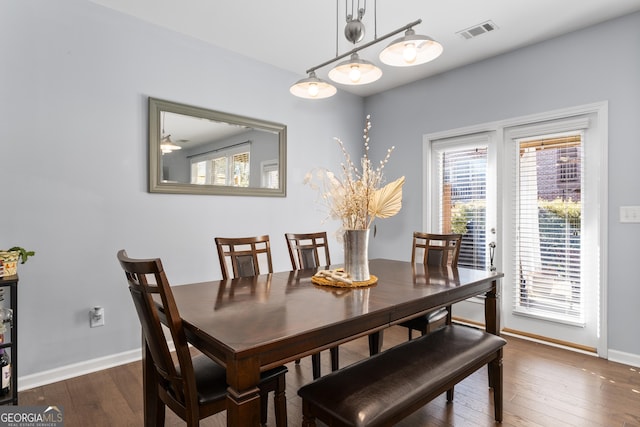 dining room featuring dark wood-type flooring