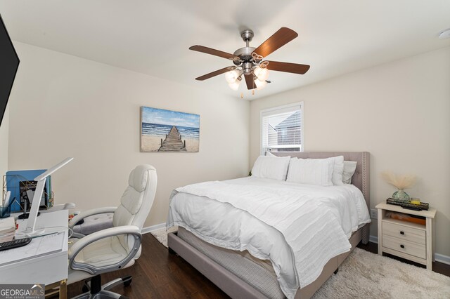 bedroom with hardwood / wood-style flooring and ceiling fan