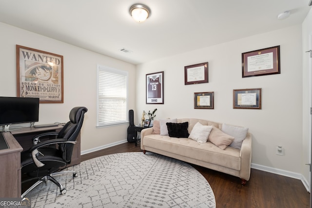 home office with dark wood-type flooring