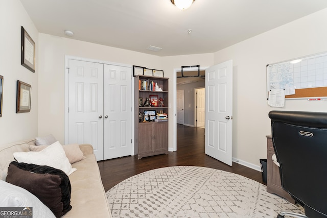 office with dark hardwood / wood-style floors