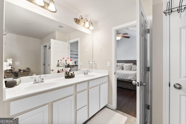 bathroom featuring vanity, hardwood / wood-style floors, and ceiling fan