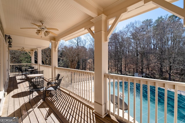 wooden deck featuring ceiling fan