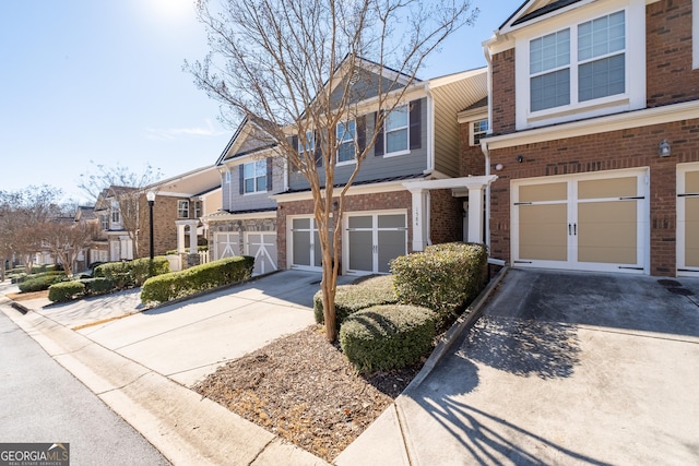 townhome / multi-family property featuring a garage