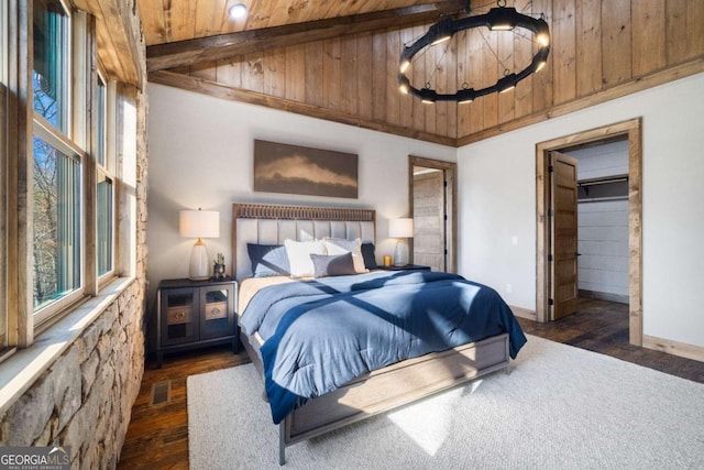 bedroom with beam ceiling, a chandelier, wooden ceiling, and dark hardwood / wood-style flooring