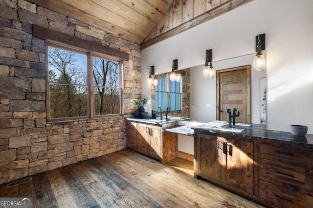 bathroom with hardwood / wood-style flooring, vaulted ceiling, and wood ceiling