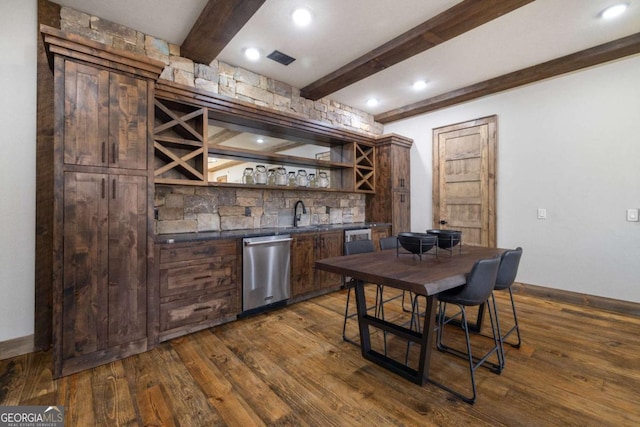 bar featuring beam ceiling, dark wood-type flooring, and stainless steel dishwasher