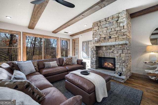 living room with beam ceiling, ceiling fan, dark hardwood / wood-style floors, and a fireplace