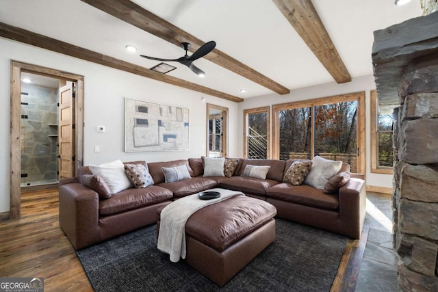 living room featuring ceiling fan, dark hardwood / wood-style floors, and beam ceiling