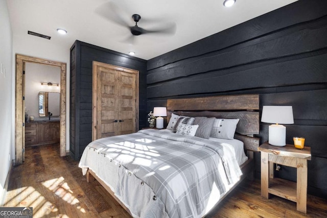 bedroom with dark wood-type flooring and ceiling fan