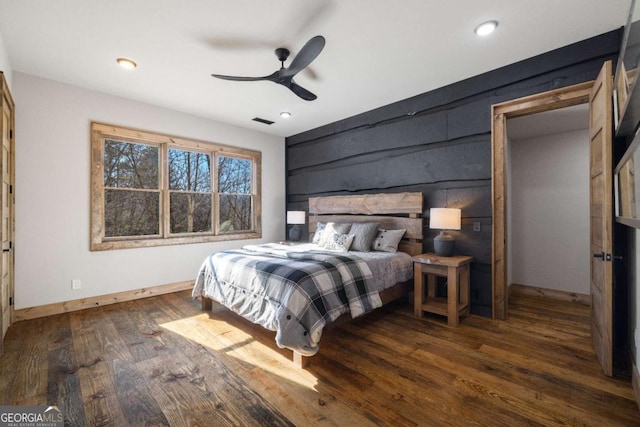 bedroom with dark wood-type flooring and ceiling fan