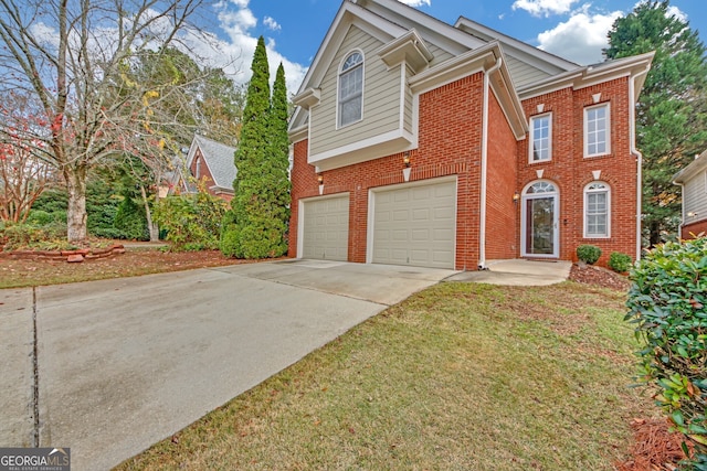 view of front facade featuring a garage and a front lawn