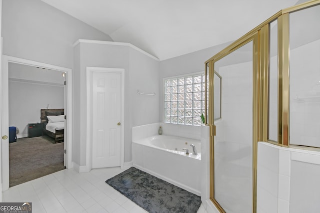 bathroom with lofted ceiling, tile patterned flooring, and separate shower and tub